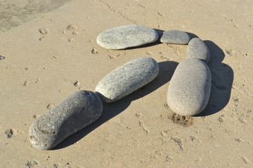 Row by stones in the form of an arrow