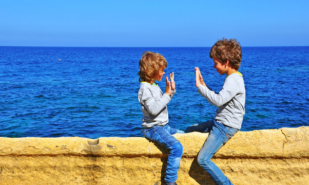 Kids playing at the sea