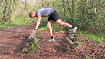 Young man working out in the forrest 