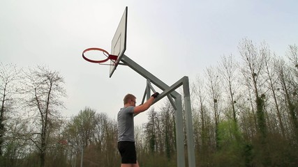 Young man doing pull up