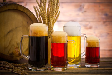 Beer barrel with beer glasses on a wooden table