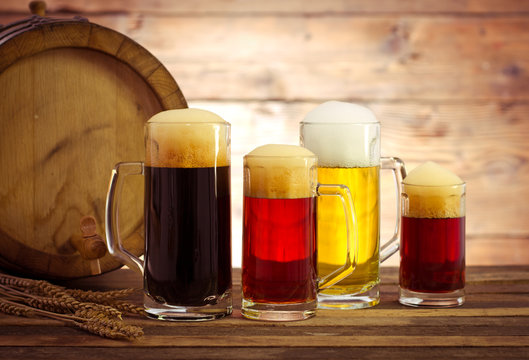 Beer barrel with beer glasses on a wooden table
