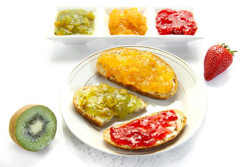  jam with slices of bread on white background
