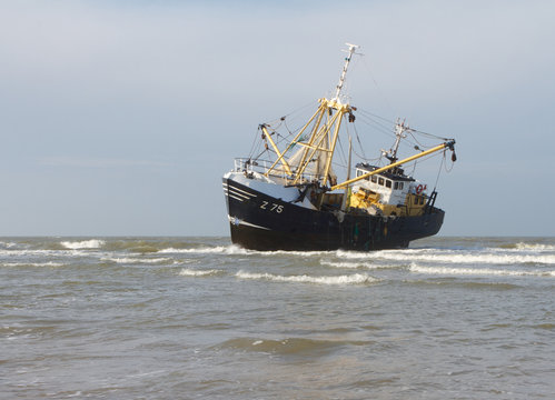 A photo of a stranded fishing boat