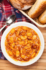 Beans with tomato sauce, bacon and sausage