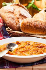 Beans with tomato sauce, bacon and sausage