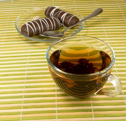 image of a cup of tea and sweets