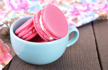 Pink macaroon in blue cup