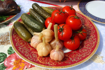 Traditional Russian tomatoes, pickled cucumbers and garlic 