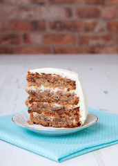 A piece of pecan cake with buttercream icing