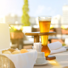 Kwak beer on the served table. Outdoors photo.