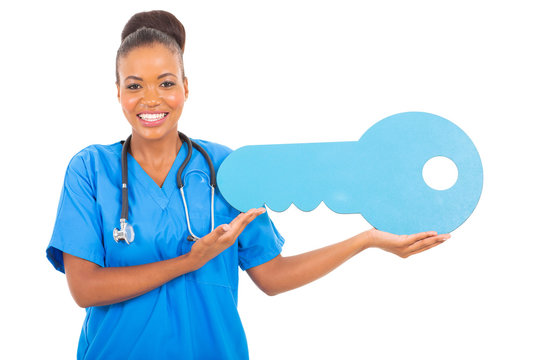 African Medical Intern Doctor Holding A Toy Key