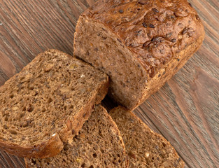Slices of brown bread on a wooden table