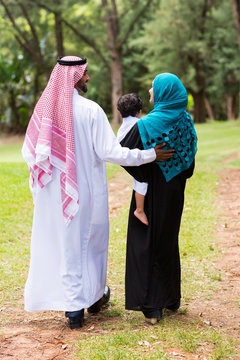 Middle Eastern Family Walking At The Park