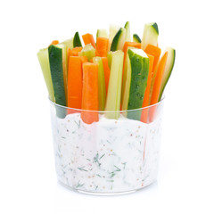 fresh vegetables in a yoghurt sauce in a glass, close-up