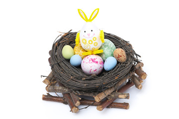nest with Easter eggs and rabbit, isolated