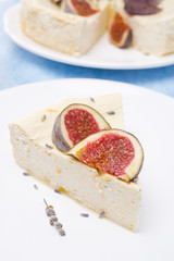 piese of cheesecake with honey and lavender and fresh figs