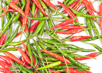 Red and green pepper on a white background