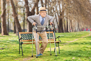 Senior gentleman with walker in the park