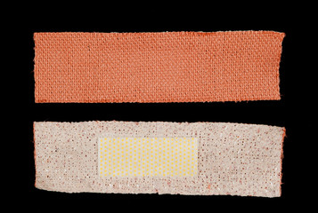 Band aid isolated over a black background
