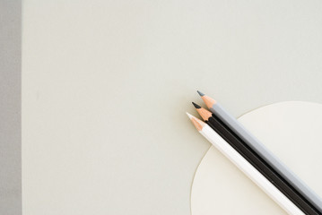creative desktop - pencils on grey paper - Studio Shot from above