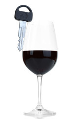 Composition with car key and glass of wine, isolated on white