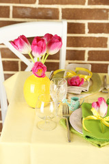 Beautiful spring table setting on bright background