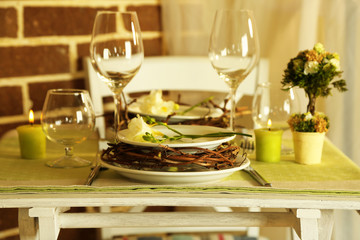 Beautiful holiday Easter table setting in green tones,