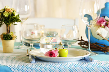 Beautiful holiday Easter table setting in blue tones,