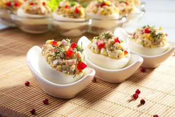 stuffed eggs with ham, red pepper and dill