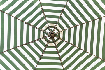 Green and white umbrella beach