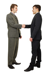Young business people shaking hands, finishing up a meeting