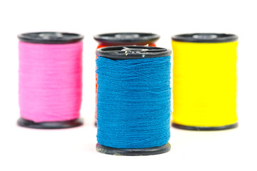 colorful sewing Threads isolated on white background