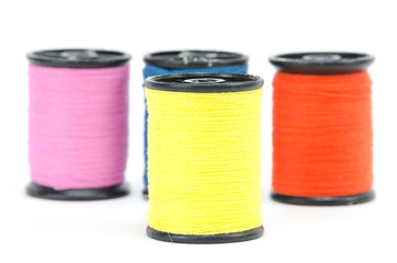 colorful sewing Threads isolated on white background