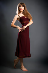 Fototapeta premium brunette in a red dress