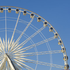 Beautiful large Ferris wheel. And the blue sky.