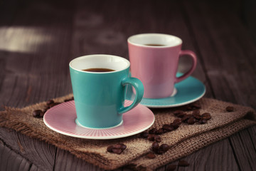 Cups of espresso on a wooden table
