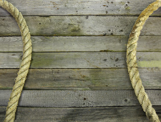 Obraz premium Wooden background with rope