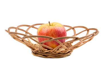 Sweet red apple in wicker