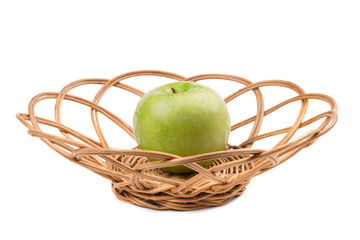Green apple in wicker