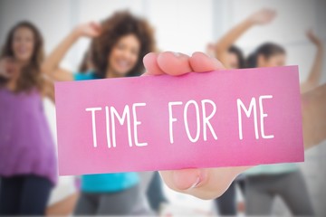 Woman holding pink card saying time for me