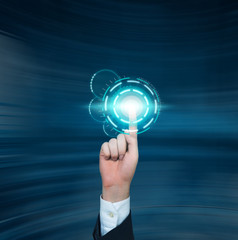 A businessman pushing the digital button