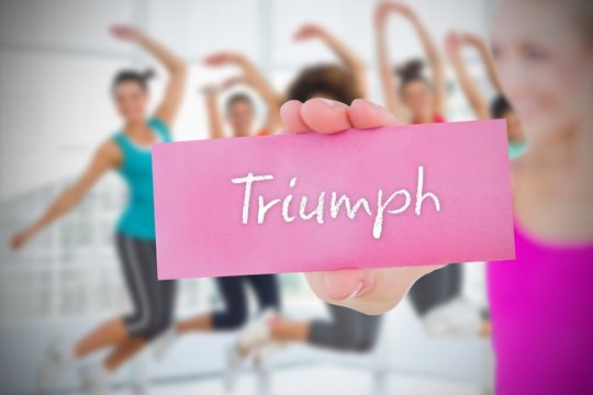 Fit blonde holding card saying triumph