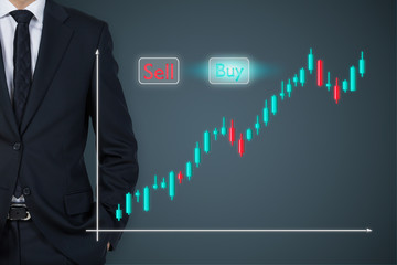 Businessman and glass screen with stock quotations.