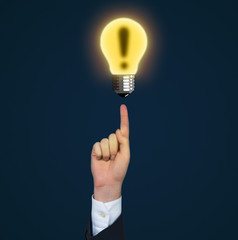 A finger pointing out to exclamation mark. Blue background.