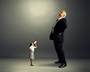 displeased woman and laughing man