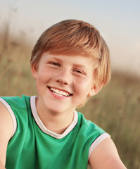 Smiling boy outdoors portrait