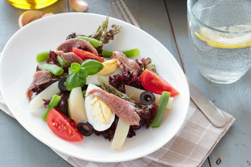 Mediterranean salad with anchovies and olives