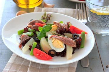 Mediterranean salad with anchovies and olives