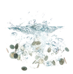 coins falling into the clear water